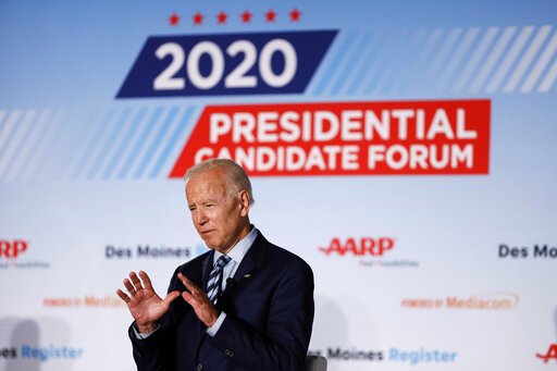 Democratic presidential candidate Joe Biden describes his healthcare plan during a presidential candidates forum sponsored by AARP and The Des Moines Register in Iowa. (AP Photo/Charlie Neibergall)