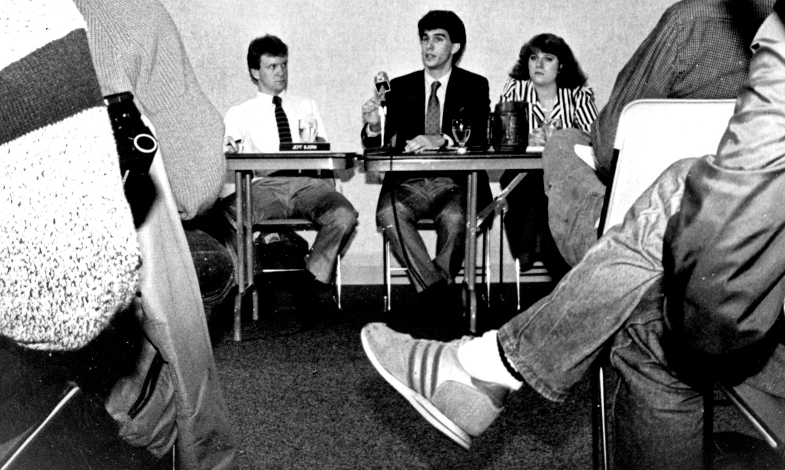 The 1987 Marquette yearbook shows student government officials Jeff Bjorn, Scott Walker and Kiki White announcing results of an impeachment probe of student leaders. Source: Dept. of Special Collections and University Archives, Marquette U. Libraries