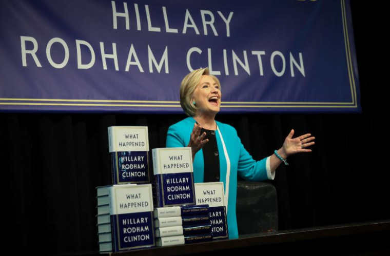 Former Democratic nominee Hillary Clinton acknowledges the audience as she arrives to sign copies of her new book "What Happened" during an event in New York City. (Getty Images)