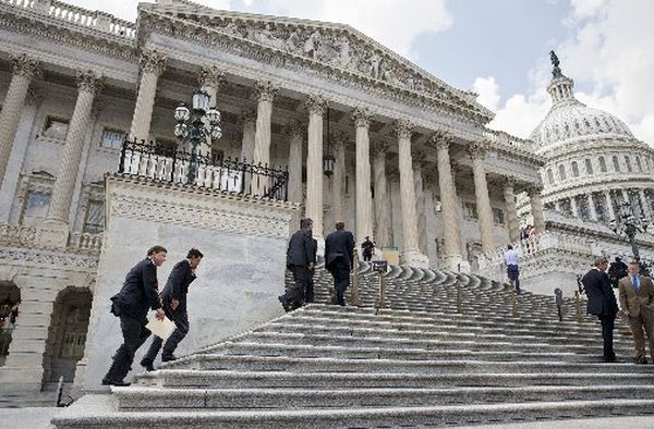 Members Congress climb the steps of the U.S. House of Representatives for votes on July 31, 2014.