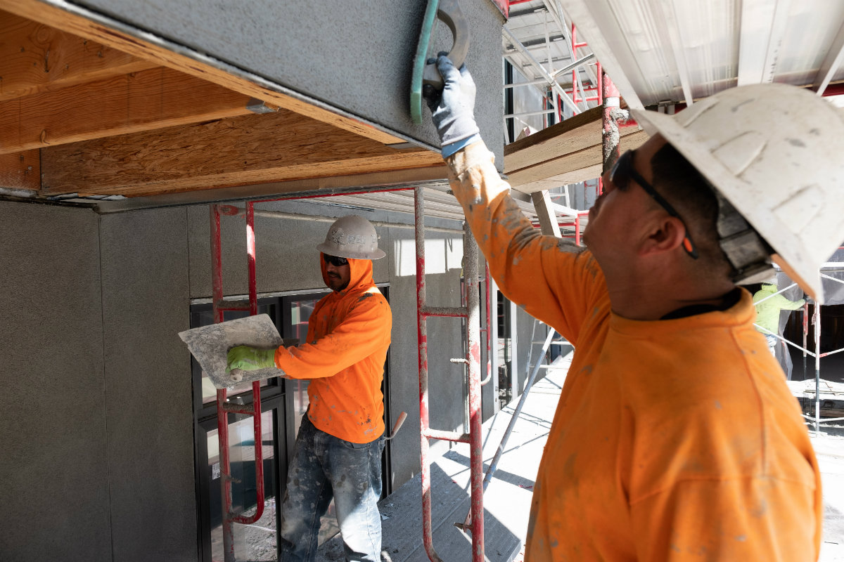 Construction crews work on The Press building, a 277-unit apartment complex in Sacramento, Calif. Andrew Nixon / Capital Public Radio