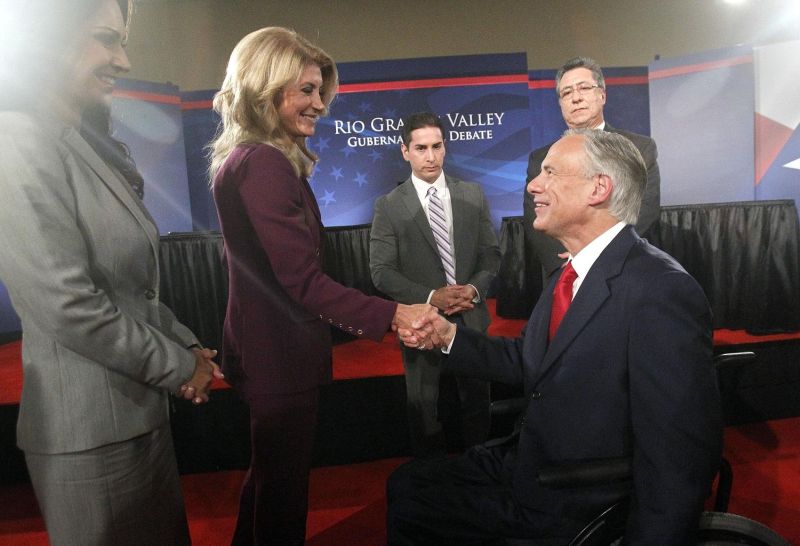 Texas state Sen. Wendy Davis shakes hands with Texas Attorney General Greg Abbott after a debate on Sept. 19, 2014. (AP photo)