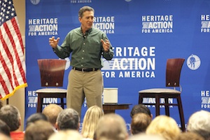 Jim DeMint speaks at the "Defund Obamacare" town hall tour in Tampa on Aug. 21, 2013. ( Eve Edelheit, Times staff)