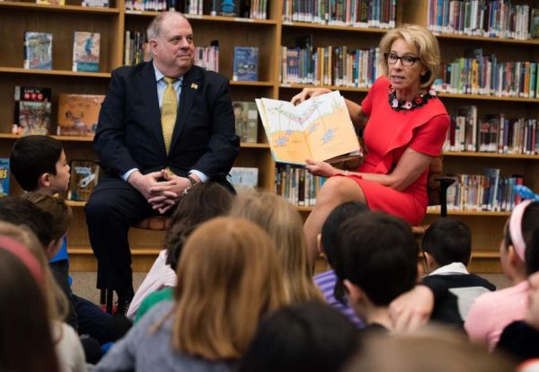 Trump administration Education Secretary Betsy DeVos, and Maryland Gov. Larry Hogan read to second-grade students at Carderock Springs Elementary School in Bethesda, Md. (Washington Post/Sarah L. Voisin)