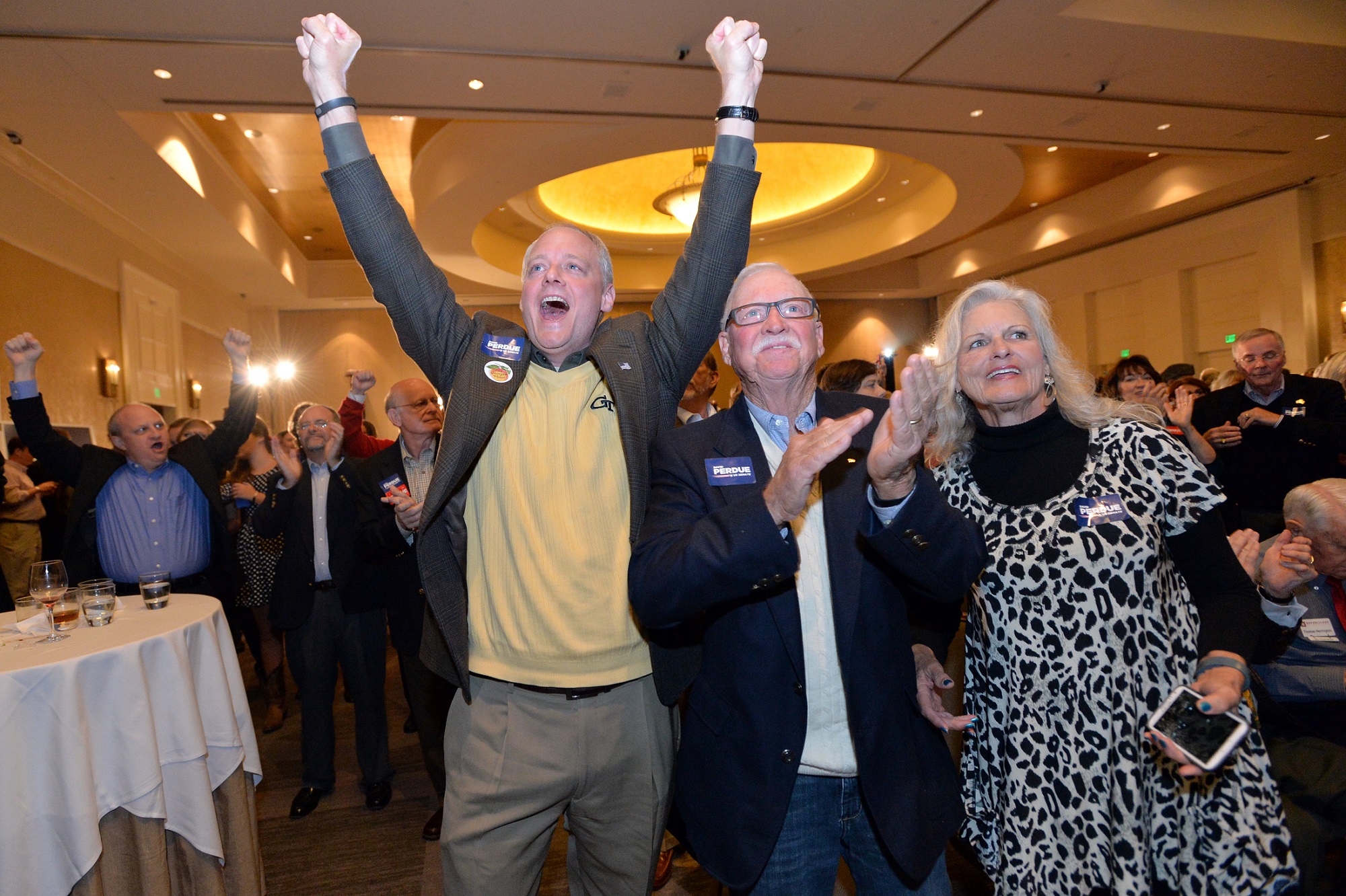 Supporters of GOP candidate for U.S. Senate David Perdue celebrate his victory Tuesday night at a party at the InterContinental Buckhead in Atlanta. Photo by Hyosub Shin / AJC.