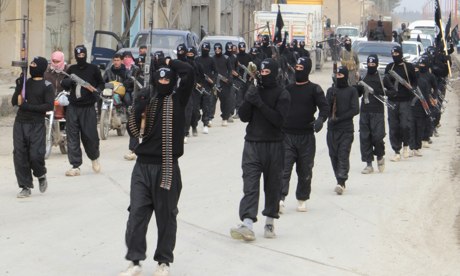 Fighters of the Islamic State of Iraq in Syria parade in Tel Abyad. Syrian rebels' uneasy co-existence with the hardline Isis has turned to outright hostility. (Reuters)