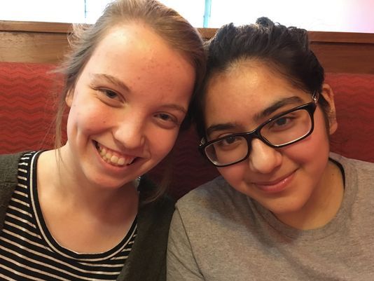 Friends Julia Craig (left) and Ravina Sachdev, high school juniors in suburban Milwaukee, agreed to disagree on a national march planned after the Florida school shooting. Sachdev participated, Craig didn't. (Annysa Johnson/Milwaukee Journal Sentinel)