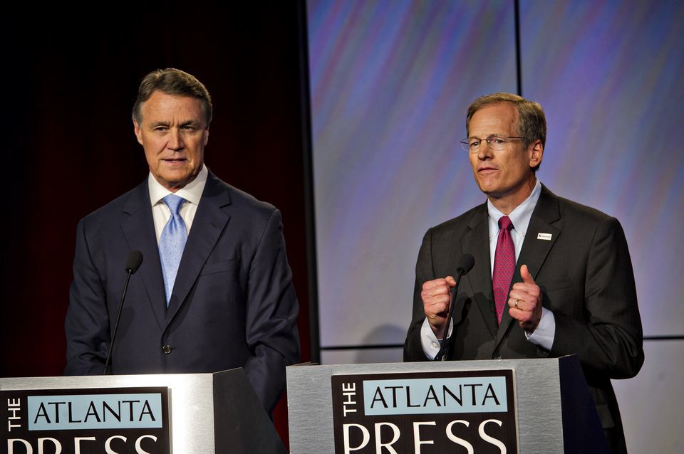 David Perdue, left, and Jack Kingston answer questions at a debate in Atlanta on July12, 2014. (Atlanta Journal-Constitution photo)