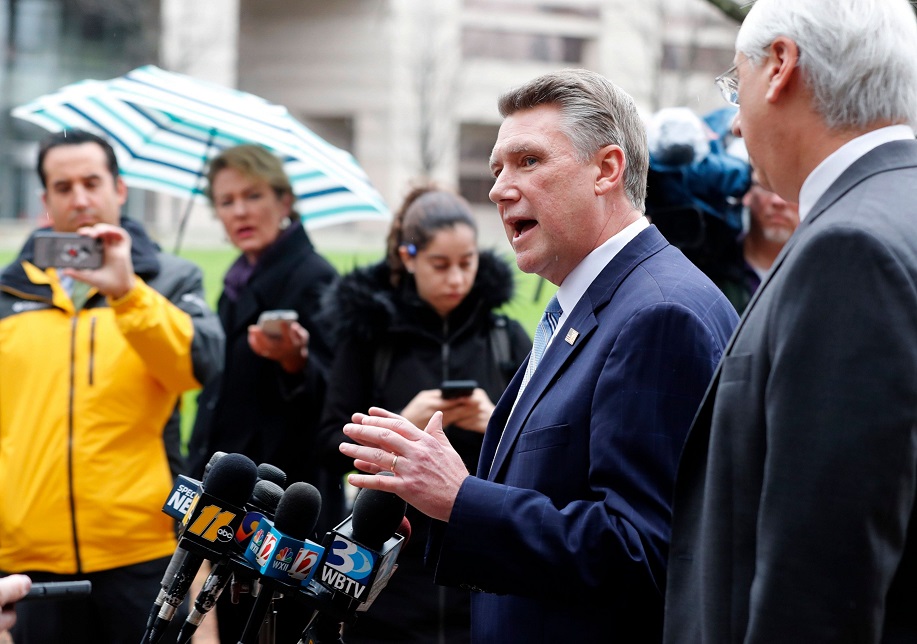 Republican Mark Harris, left, and his attorney David Freedman speak with the media after meeting with state election investigators at the Dobbs Building in Raleigh, N.C., Thursday, Jan. 3, 2019. (News & Observer)