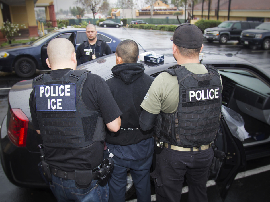 A photo released in February 2017 by U.S. Immigration and Customs Enforcement shows people being arrested during an ICE operation. Charles Reed/U.S. Immigration and Customs Enforcement / AP