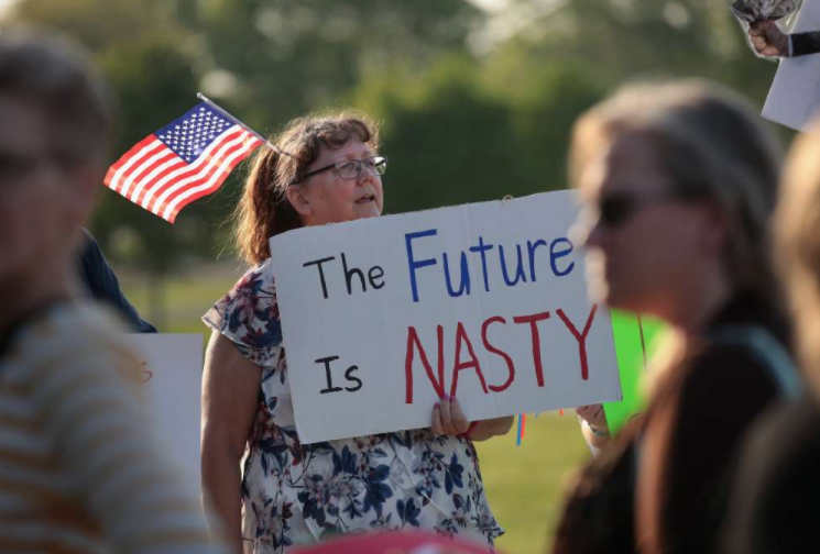A protester outside a Cedar Rapids town hall meeting with Rep. Rod Blum, R-Iowa. (Getty)