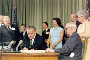 President Lyndon B. Johnson signs Medicare into law in 1965. How did U.S. health care work for seniors before that? We take a look at the statistics.