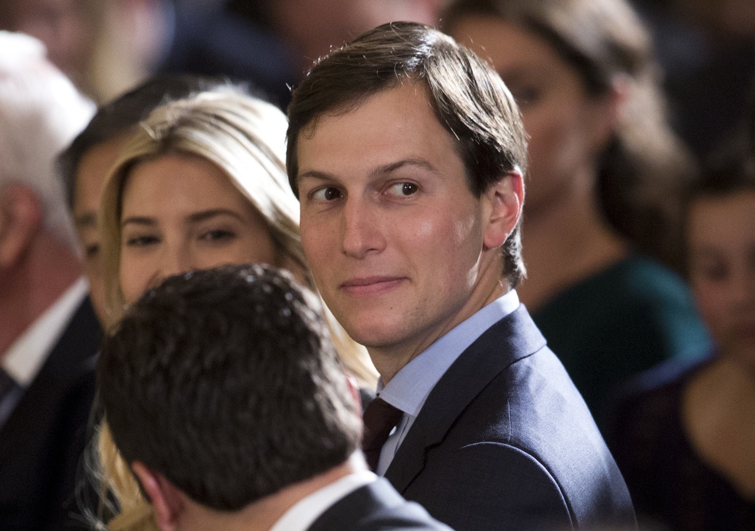 Jared Kushner, with wife Ivanka Trump, sits in the White House’s East Room in June. (Carolyn Kaster/AP)