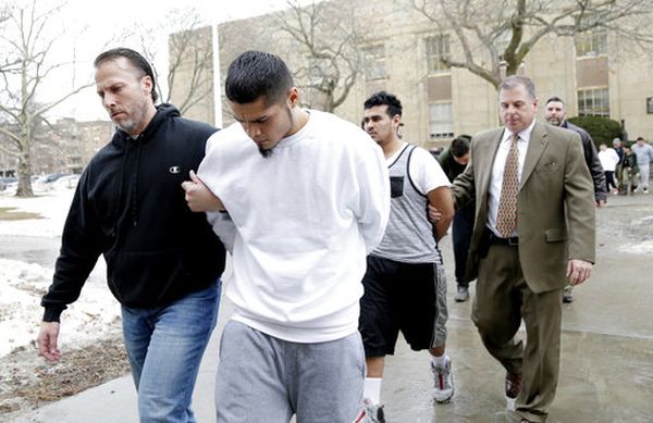 Suspected members of the MS-13 gang are escorted to their arraignment in Mineola, N.Y., on Jan. 11, 2018. (AP Photo/Seth Wenig)