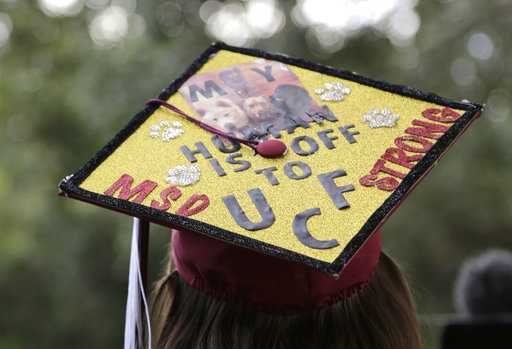 Graduate Shannon Recor leaves a graduation ceremony for Marjory Stoneman Douglas seniors, Sunday, June 3, 2018, in Sunrise, Fla. (AP)