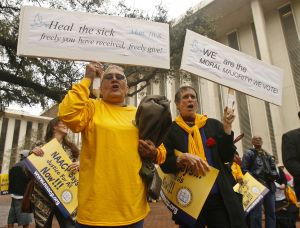 Protestors in Tallahassee, Fla., on March 3 urge the Florida Legislature to expand Medicaid. (AP Photo)