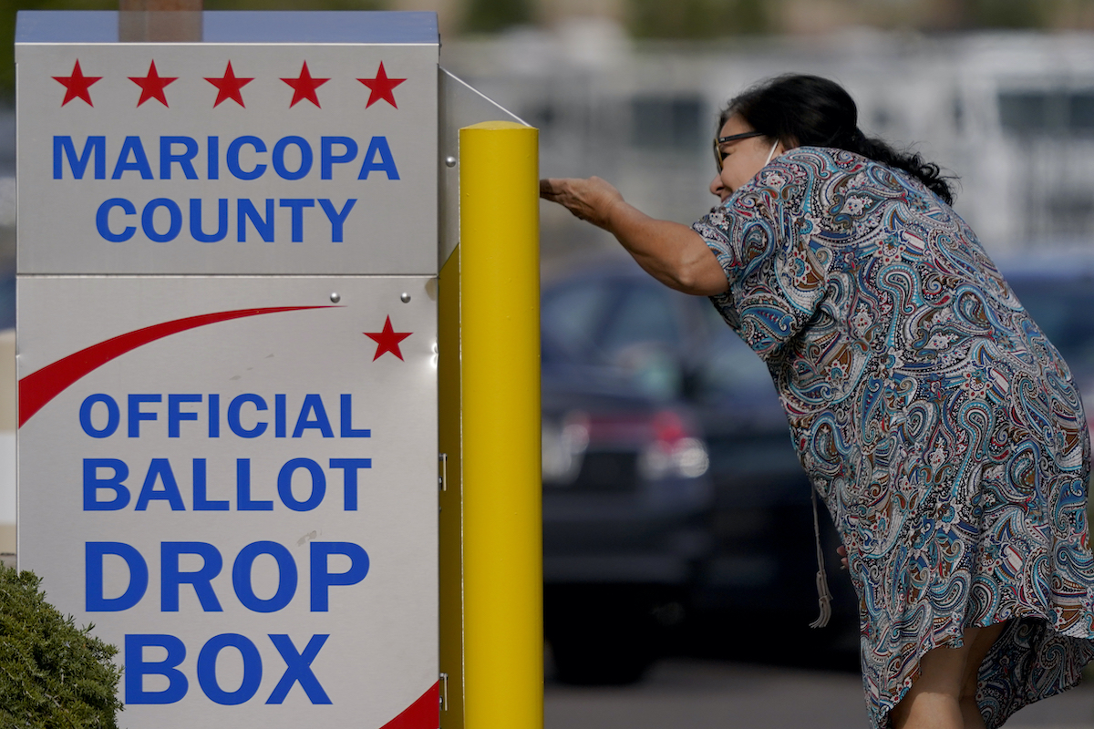 Mesa Arizona drop box voter 11 7 22 AP | Fact Check: Election denying candidates sought to undo voting rights. Many lost key races | The Paradise News