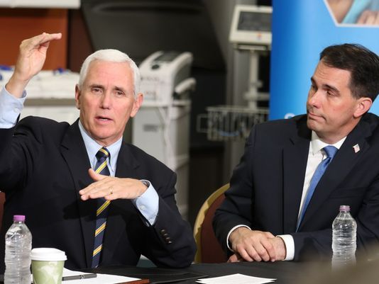 Vice President Mike Pence (left), who was joined by Wisconsin Gov. Scott Walker, appeared in Milwaukee on June 10, 2017. Pence bashed Obamacare and promised that Republicans would deliver a better replacement. (Pat A. Robinson/Milwaukee Journal Sentinel)