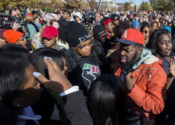 Members of Concerned Student 1950 celebrate following the resignation of Missouri University president Timothy M. Wolfe on Nov. 9, 2015. (Brian Davidson/Getty Images)