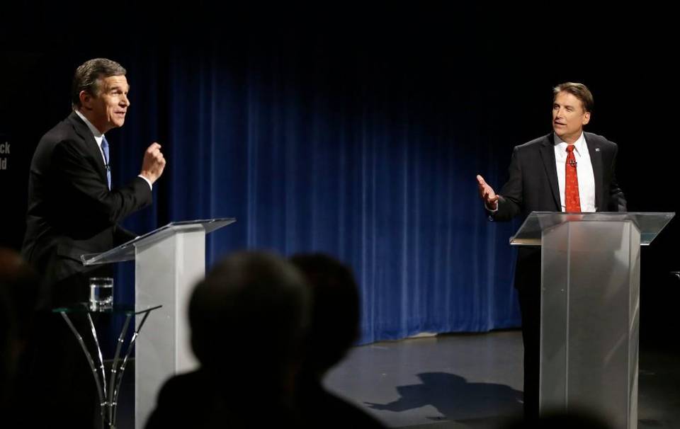 North Carolina Gov. Pat McCrory, right, faced off with challenger Attorney General Roy Cooper, left, in a debate on Tuesday, Oct. 11. Associated Press photo.
