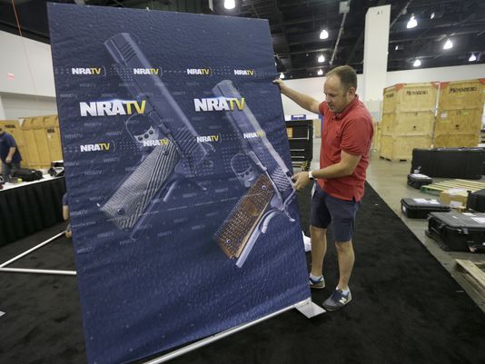 An NRA TV videographer helps set up for the NRA Carry Guard Expo in Milwaukee. (Mike De Sisti/Milwaukee Journal Sentinel)