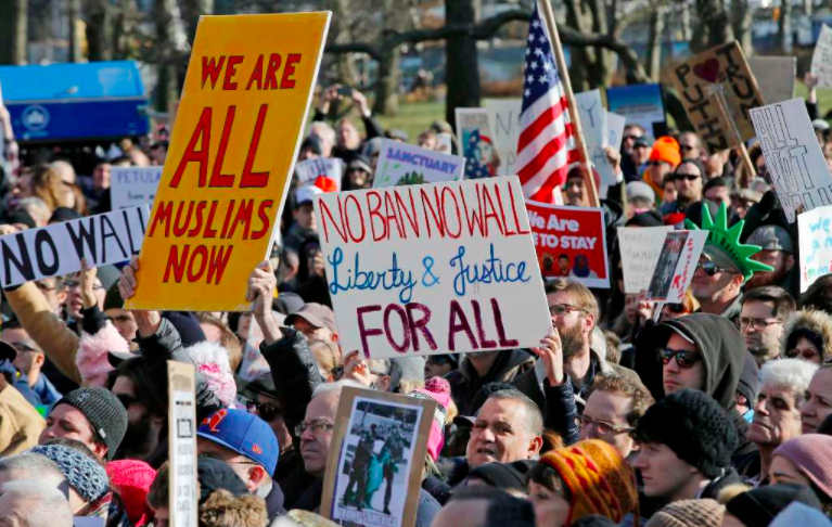Protesters and immigrants rights advocates gathered at Castle Clinton National Monument, the physical departure and arrival point for tours of the Statue of Liberty in New York City. (AP)