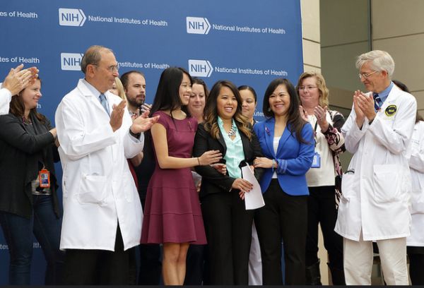 Ebola patient Nina Pham (center) with her family and supporters after a press briefing on her release from the National Institutes of Health in Bethesda, Md., on Oct. 24, 2014. (NIH photo)