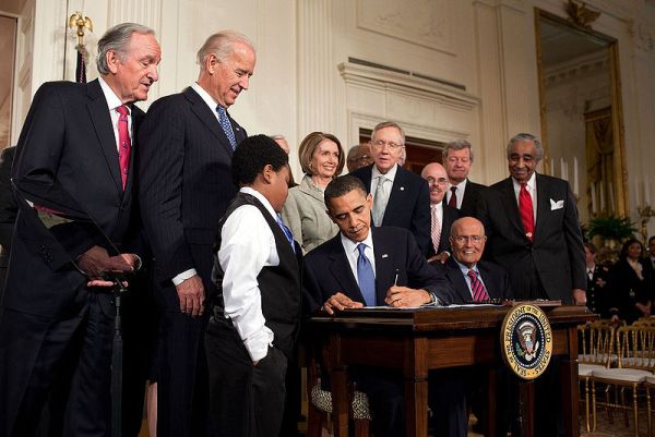 Barack Obama signing the Affordable Care Act at the White House in 2010. (Wikimedia Commons)