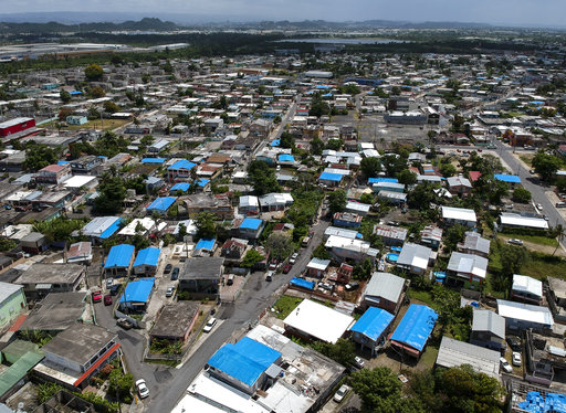 This June 18, 2018 photo shows an aerial view of the Amelia neighborhood in the municipality of Catano following Hurricane Maria in Puerto Rico. (AP)