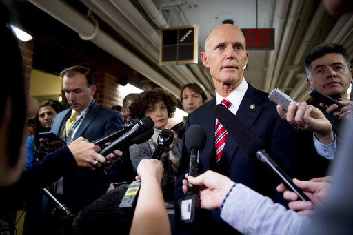 Sen. Rick Scott, R-Fla., speaks to reporters outside his office on Capitol Hill in Washington, Wednesday, Jan. 23, 2019. Scott took questions on Venezuela and the government shutdown. (AP)