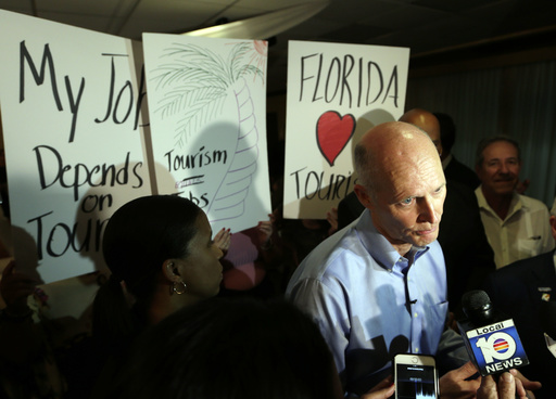 Florida Gov. Rick Scott speaks with the news media following a jobs roundtable about the economic impact of Visit Florida and Enterprise Florida, Thursday, March 2, 2017, in Hialeah, Fla. (AP)