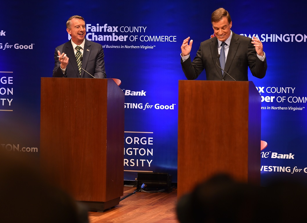 Democratic U.S. Sen. Mark Warner, right, gestures as his opponent Republican Ed Gillespie, answers a question during Tuesday evening's Virginia U.S. Senate Debate. AP Photo.