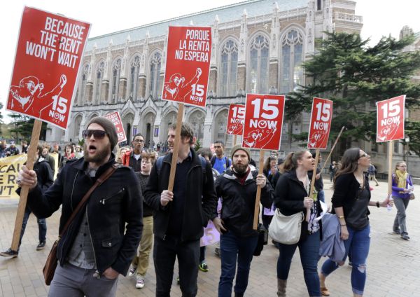 Students and other supporters protest on the University of Washington campus in Seattle in support of raising the minimum wage for campus workers to $15 an hour on April 1, 2015. (AP/Ted S. Warren)