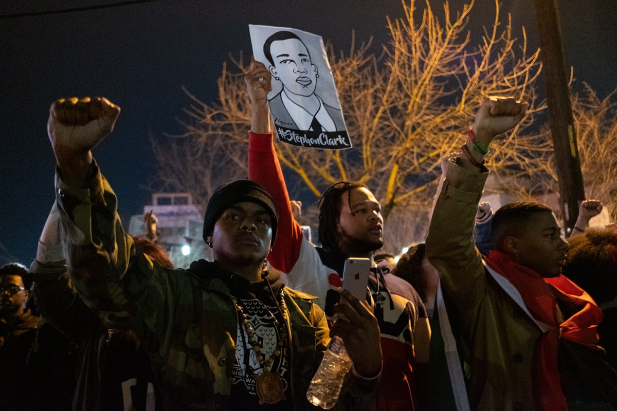 Demonstrators march through East Sacramento to protest the DA not filing criminal charges against the officers who shot and killed Stephon Clark. Andrew Nixon / Capital Public Radio