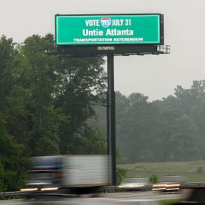 A sign urging voters to approve a tax to pay for transportation projects across metro Atlanta flashes over I-75 in Henry County.