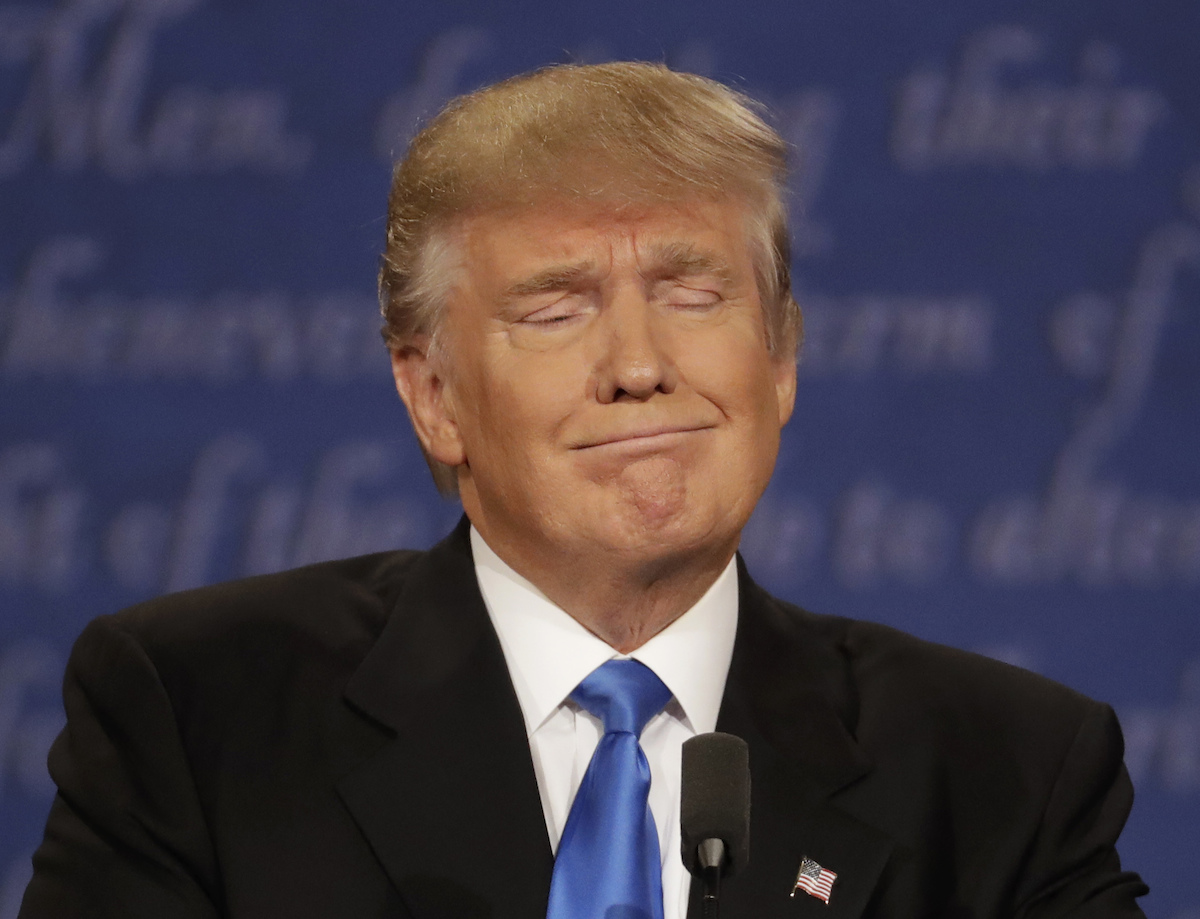 Republican presidential nominee Donald Trump listens to Democratic presidential nominee Hillary Clinton during the presidential debate at Hofstra University in Hempstead, N.Y., Monday, Sept. 26, 2016. (AP Photo/Patrick Semansky)
