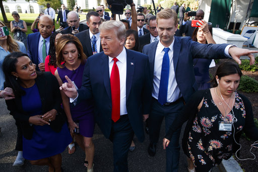 President Donald Trump holds an impromptu news conference with reporters at the White House. (AP Photo/Evan Vucci)