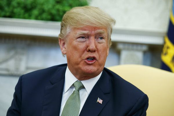 President Donald Trump talks with reporters during a meeting in the Oval Office on March 15, 2018. (AP/Evan Vucci, File)