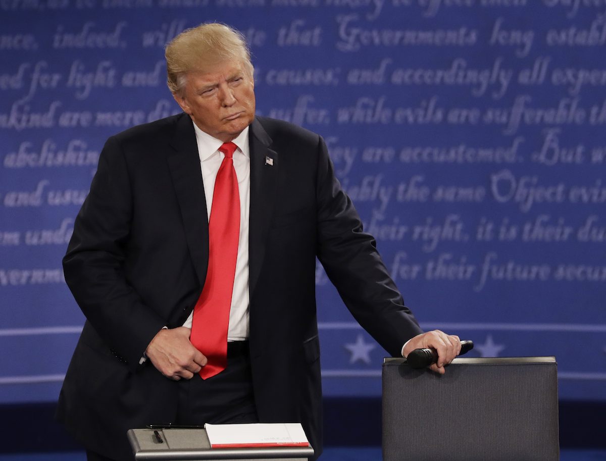 Republican presidential nominee Donald Trump listens to Democratic presidential nominee Hillary Clinton during the second presidential debate at Washington University in St. Louis, Sunday, Oct. 9, 2016. (AP Photo/Patrick Semansky)