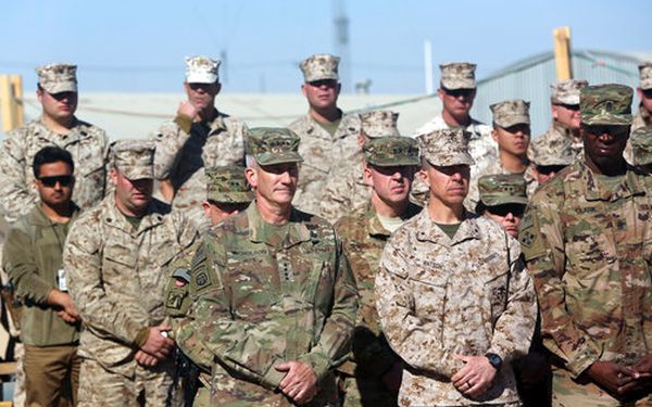 The commander of NATO and U.S. forces in Afghanistan, Army Gen. John W. Nicholson, first left, and his colleagues take part in a change of command ceremony in Afghanistan, on Jan. 15, 2018. (AP/Massoud Hossaini)