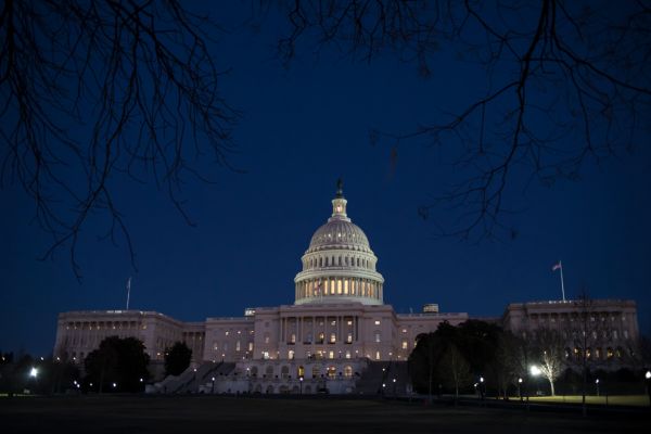 The U.S. Capitol is illuminated on Jan. 19, 2018. (AP/J. Scott Applewhite)
