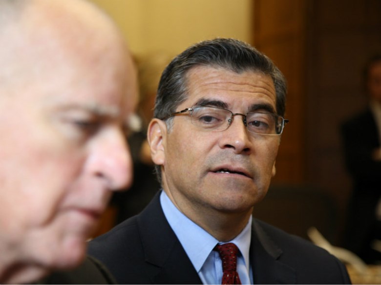 California Attorney General Xavier Becerra (right) and Governor Jerry Brown
