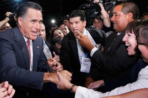 Mitt Romney greets crowd members at NALEO's conference in Florida June 21, 2012 (Photo by The Associated Press).