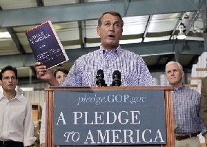 John Boehner of Ohio, who went on to become Speaker of the House, holds up a copy of the GOP agenda, "A Pledge to America," in 2010.