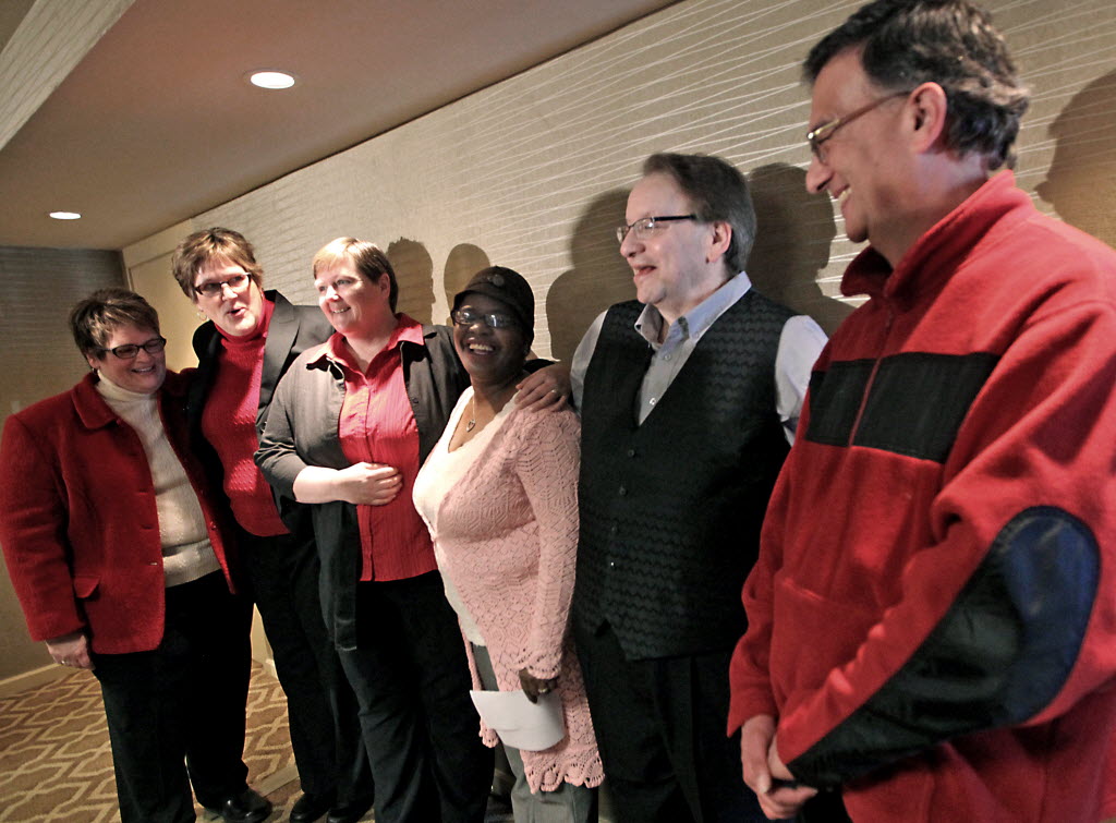 Plaintiffs in a federal lawsuit challenging Wisconsin's ban on gay marriage appear during a press conference at the Concourse Hotel in Madison, Feb. 3, 2014. AP