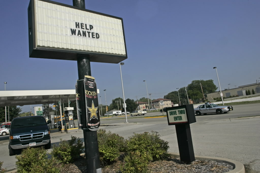 A help wanted sign is seen in the window of a Miami store on Sept. 4, 2015. (Photo by Joe Raedle/Getty Images)