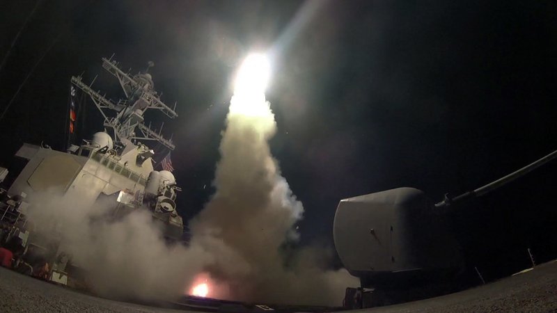 In this image provided by the U.S. Navy, the guided-missile destroyer USS Porter (DDG 78) launches a tomahawk land attack missile in the Mediterranean Sea, Friday, April 7, 2017. (Mass Communication Specialist 3rd Class Ford Williams/U.S. Navy via AP)