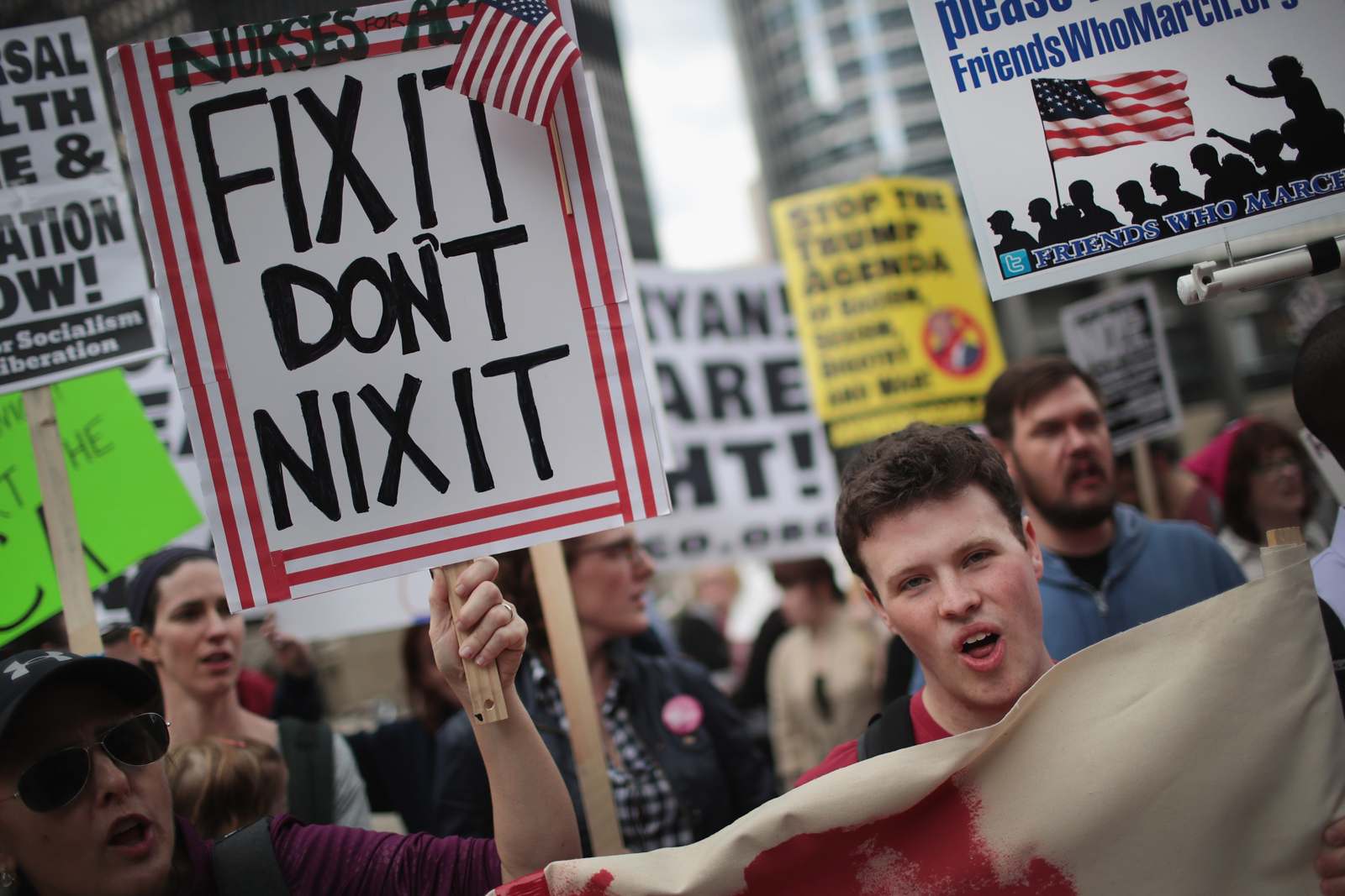 Demonstrators gather near Trump Tower in Chicago to celebrate the defeat of President Donald Trump's revision of the Affordable Care Act March 24, 2017. (Scott Olson/Getty Images)