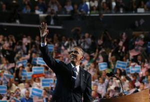 President Barack Obama waves to delegates before giving his acceptance speech at the Democratic National Convention.