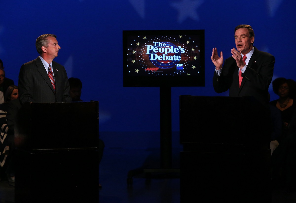 Sen. Mark Warner, D-Va., right, gestures as Republican challenger Ed Gillespie listens during Monday night's People's Debate at WCVE studios in Chesterfield County.
